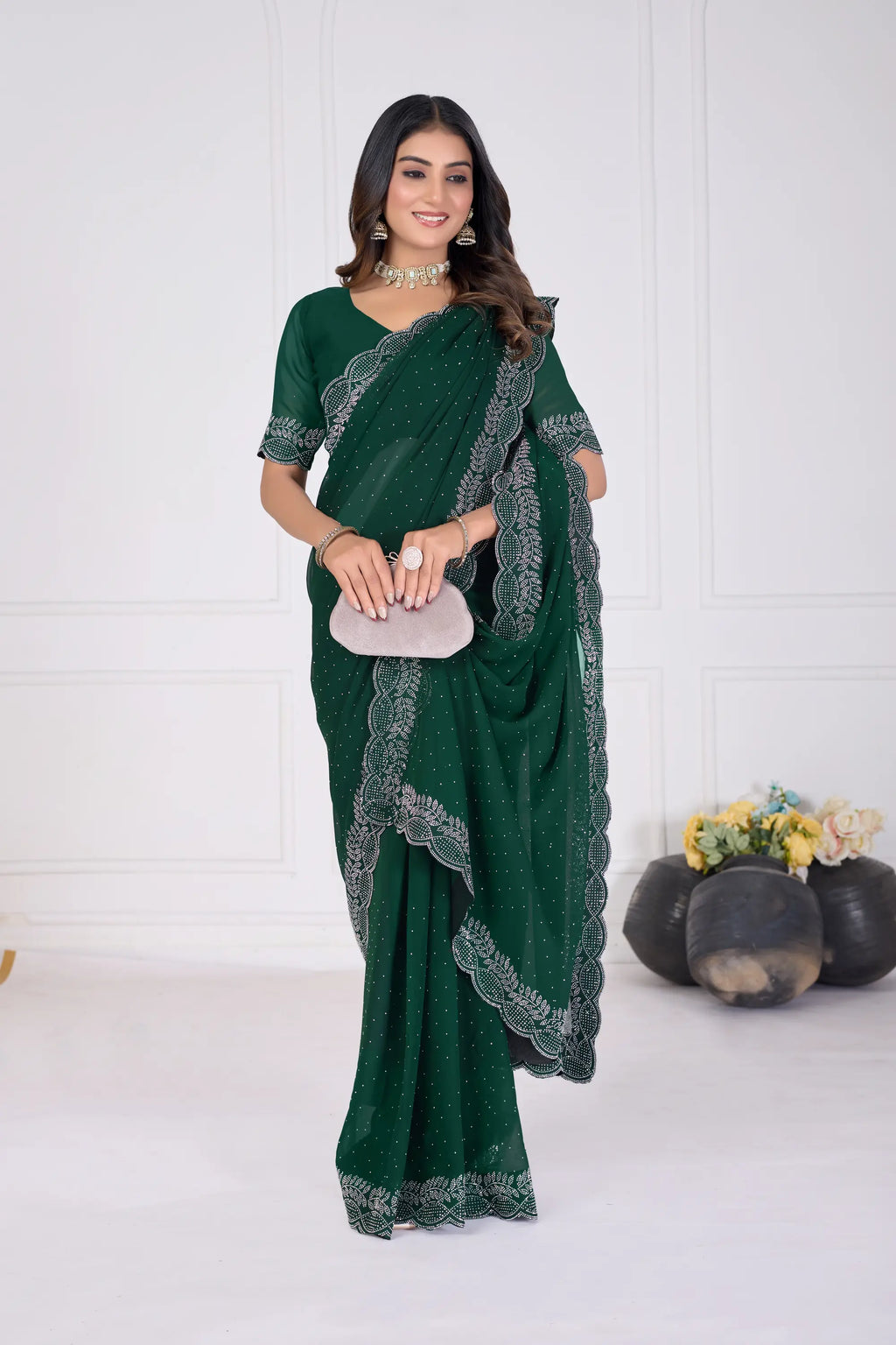 Woman wearing a green saree with a white background